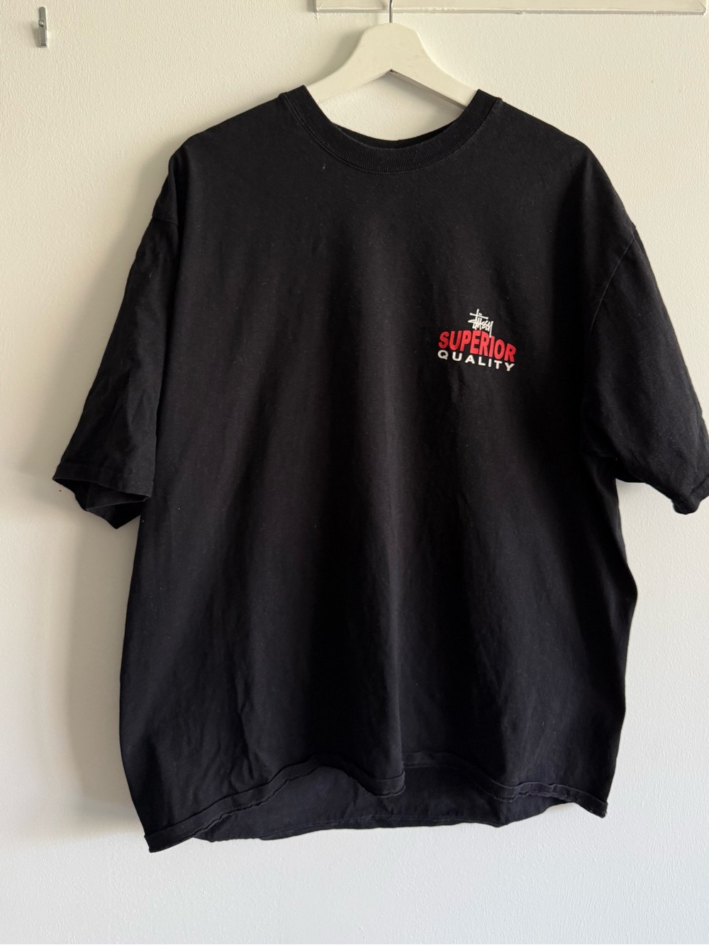 Stussy Black Short Sleeve Tee with Red Chest Graphic